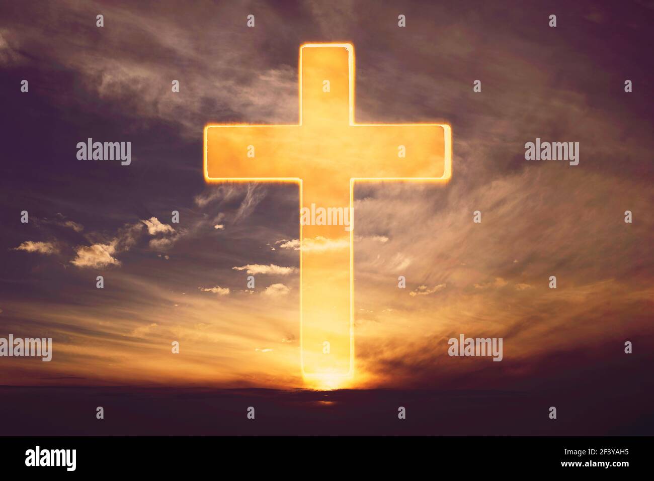 Silhouette of shining cross on sunset, sunrise background. Banner. Copy space. Easter, Ascension day concept. Church worship. Faith symbol. Gate to Stock Photo