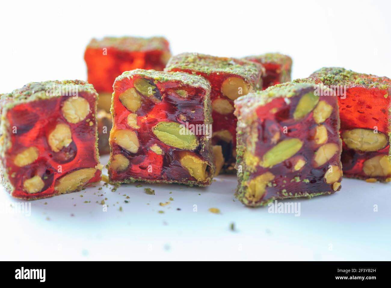 Turkish delight - lokum or rahat lokum with pistachios on grey ...