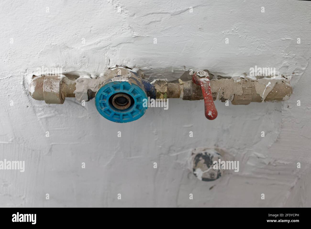 Water supply fittings on the wall Stock Photo