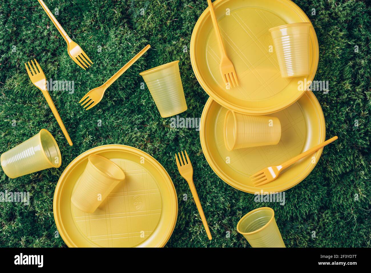 Recycling plastic and ecology. Disposable plastic tableware plates, forks, spoons, knives. Top