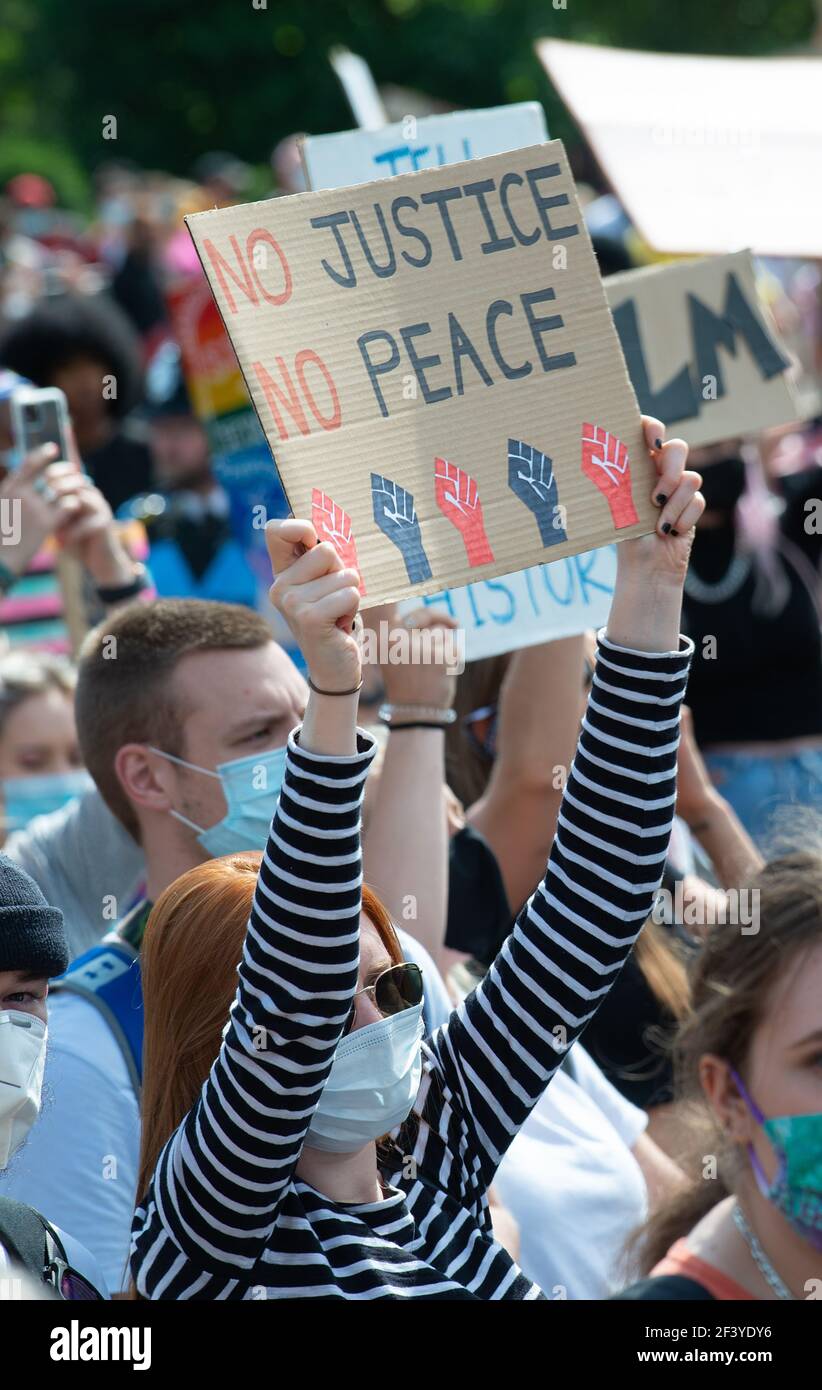 End Racism Protest Anti-racism campaigner with sign, at the Black Lives Matter ...