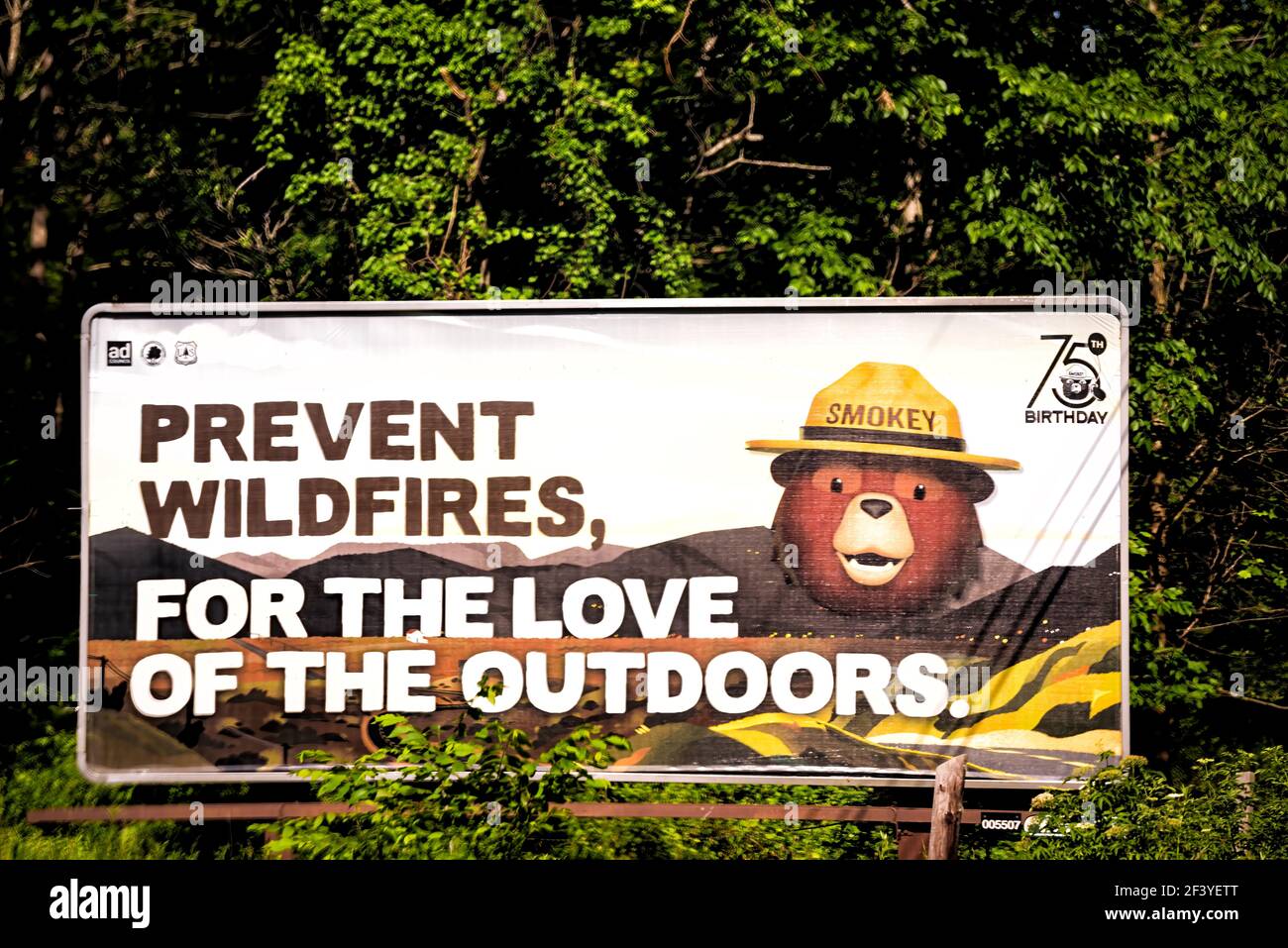 Shenandoah National Park, USA - June 9, 2020: Prevent wildfires, for love of outdoors warning danger sign with bear ranger mascot from National park s Stock Photo