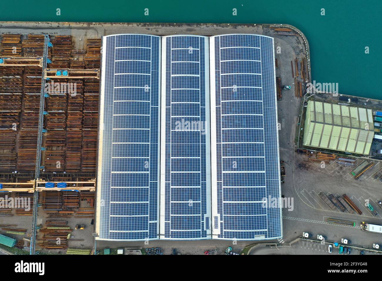 Solar power panels on factory roof Stock Photo - Alamy