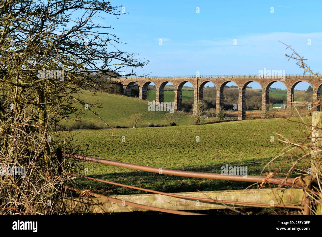 View looking towards the Ayr to Dalmelington railway viaduct near the village of Dalrymple on a March afternoon. Stock Photo