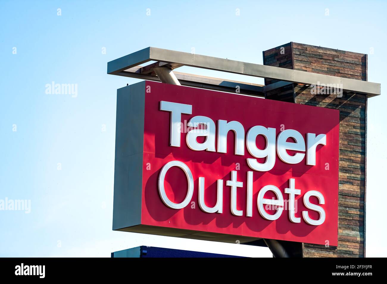 Daytona Beach, USA - May 10, 2018: Closeup of Tanger Factory Outlets shopping center retail mall sign in Florida city town with designer stores shops Stock Photo