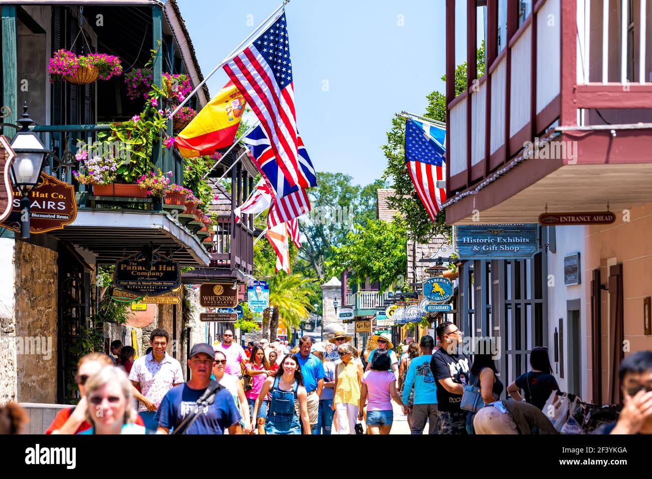 St. Augustine, USA - May 10, 2018: People shopping at Florida city St George Street by stores shops and restaurants in old town city with American and Stock Photo