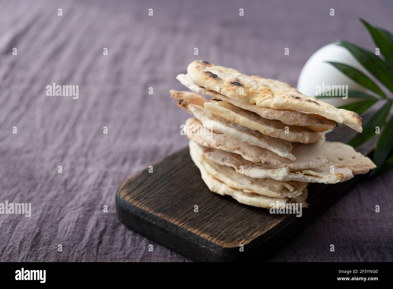 Homemade matzo with microgreen peas. Unleavened flatbread bread. Pesah
