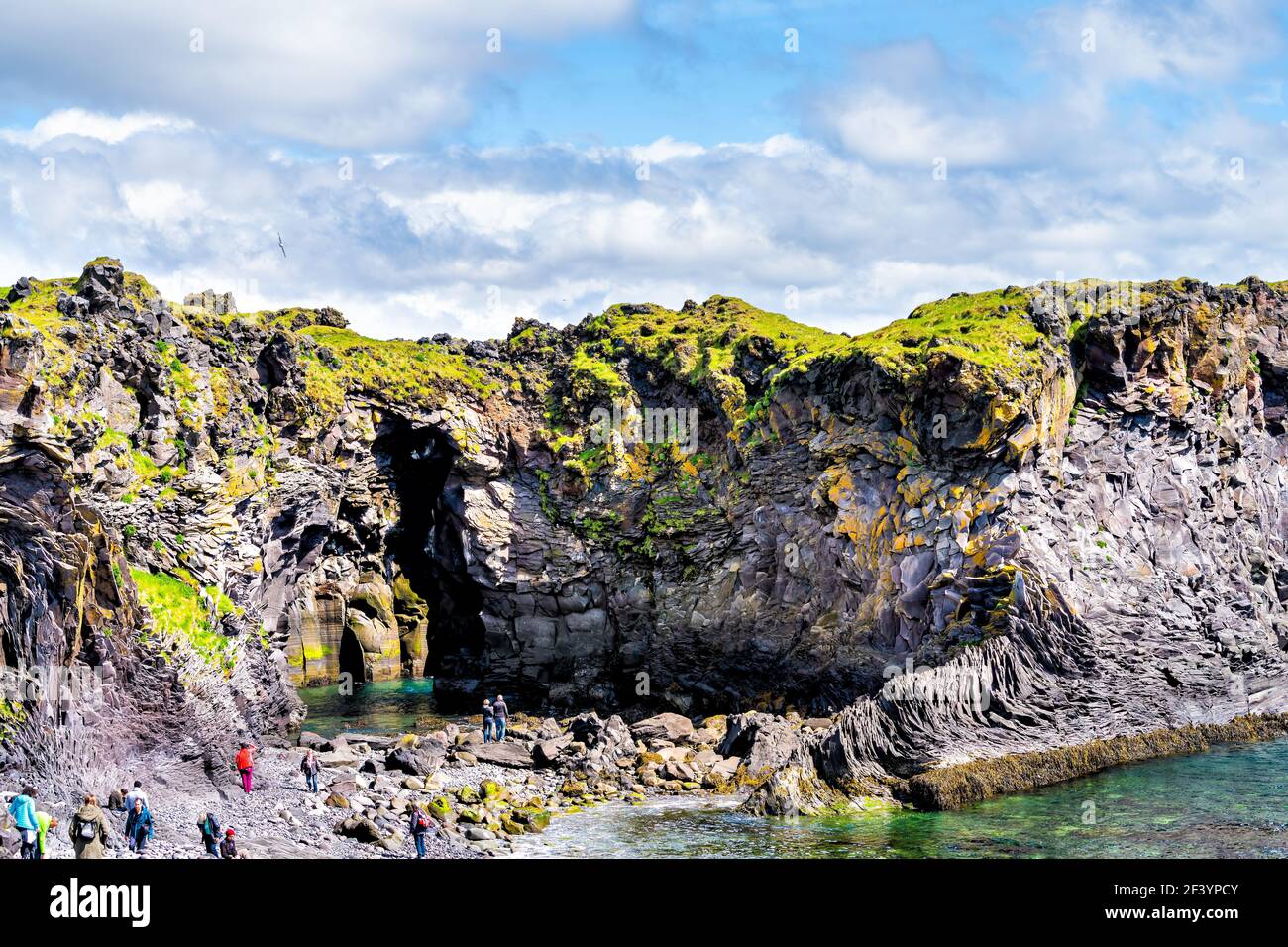 Snaefellsjokull, Iceland - June 18, 2018: Landscape view of rocky formation in Hellnar National park Snaefellsnes Peninsula with ocean and cave cove p Stock Photo