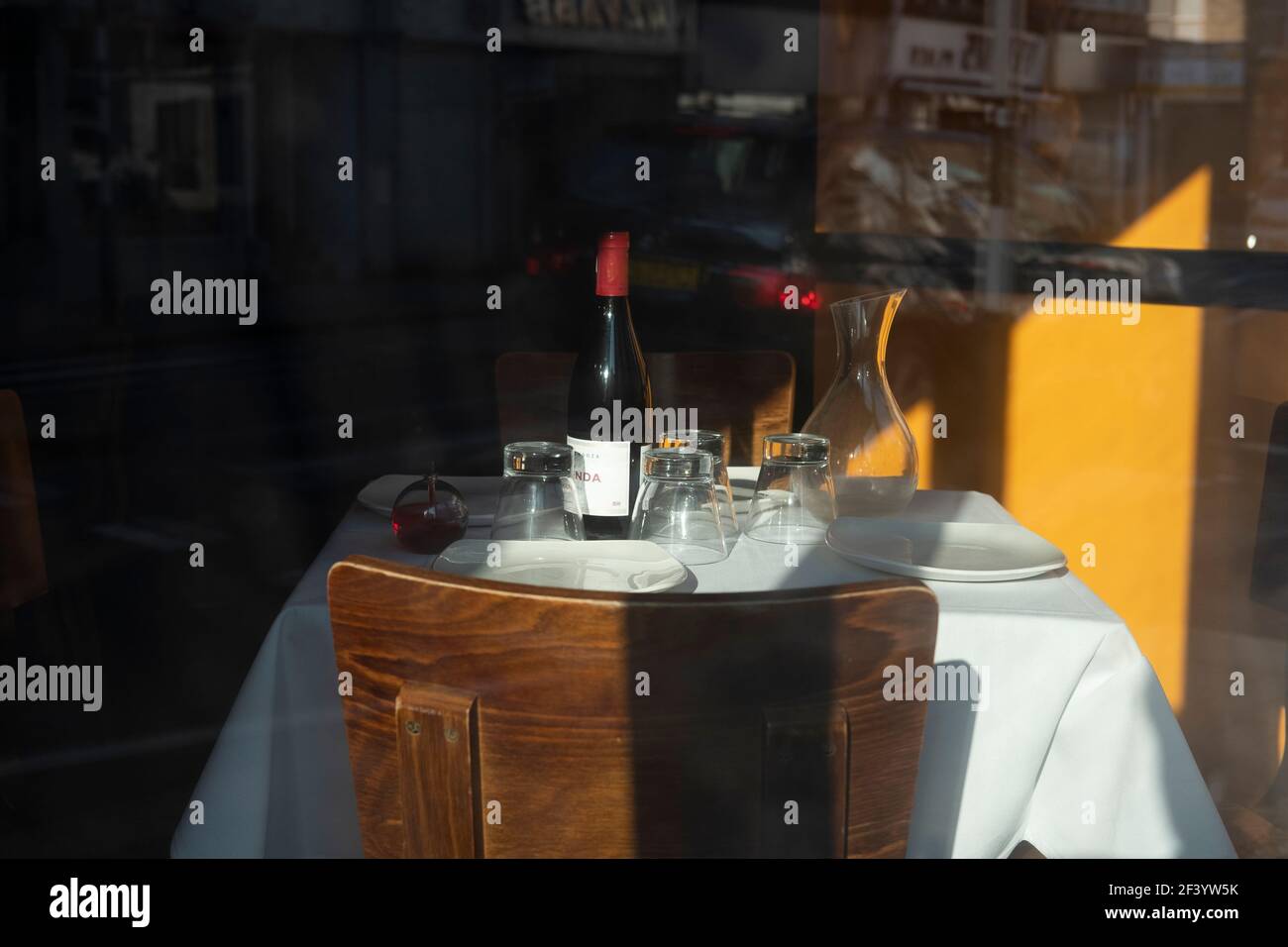 Set table on empty restaurant in London, Fuhlam Road, during Covid -19 pandemoc lockdown, March 2021, London,UK Stock Photo
