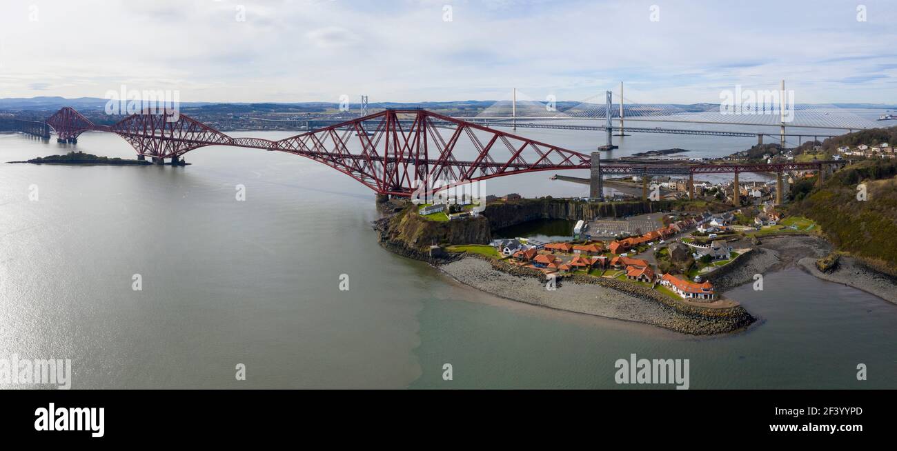 North Queensferry, UK. 18th Mar 2021.  Spring Weather: Panoramic view of the three bridges that span the Firth of Forth at North Queensferry, The Forth Rail Bridge, Forth Road bridge and the Queensferry Crossing. Credit: Ian Rutherford/Alamy Live News. Stock Photo