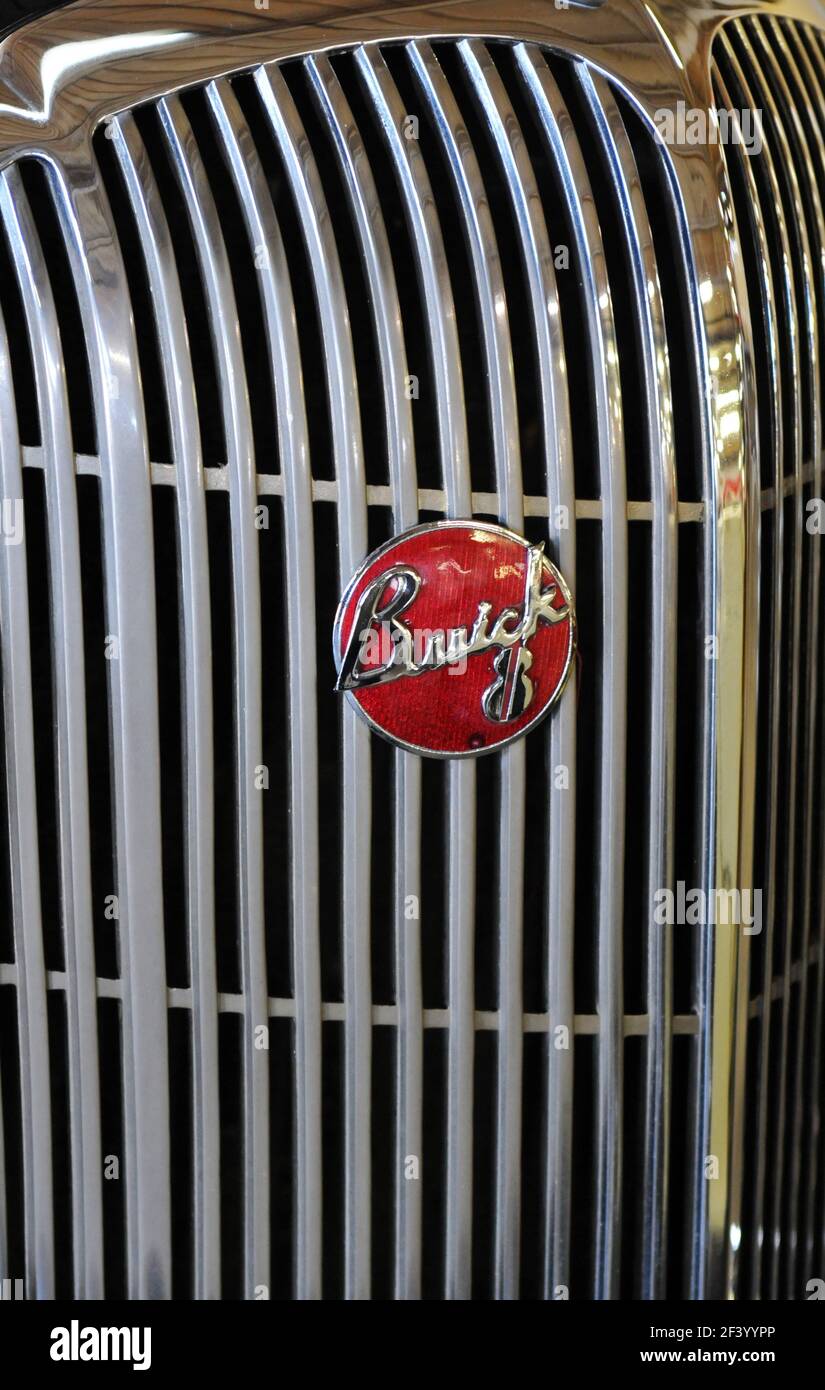 Detail showing the emblem on the chrome radiator grille of a classic