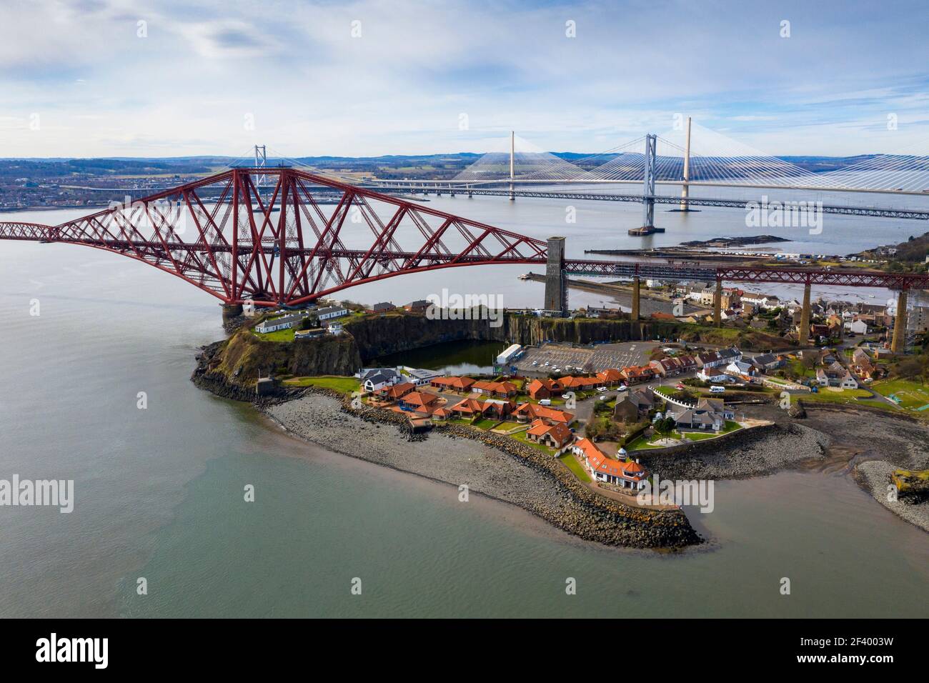 North Queensferry, UK. 18th Mar 2021.  Spring Weather: Panoramic view of the three bridges that span the Firth of Forth at North Queensferry, The Forth Rail Bridge, Forth Road bridge and the Queensferry Crossing. Credit: Ian Rutherford/Alamy Live News. Stock Photo