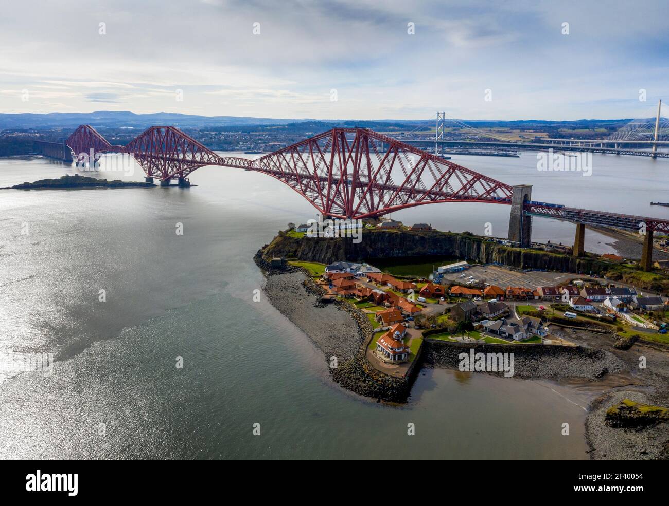 North Queensferry, UK. 18th Mar 2021. Spring Weather: Panoramic view of the three bridges that span the Firth of Forth at North Queensferry, The Forth Rail Bridge, Forth Road bridge and the Queensferry Crossing. Credit: Ian Rutherford/Alamy Live News. Stock Photo