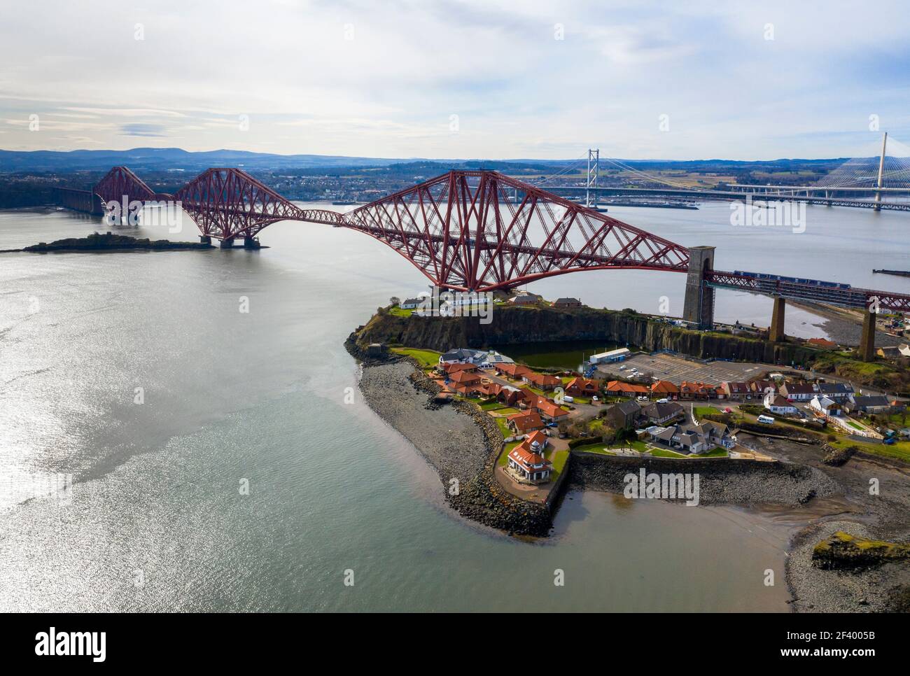 North Queensferry, UK. 18th Mar 2021.  Spring Weather: Panoramic view of the three bridges that span the Firth of Forth at North Queensferry, The Forth Rail Bridge, Forth Road bridge and the Queensferry Crossing. Credit: Ian Rutherford/Alamy Live News. Stock Photo