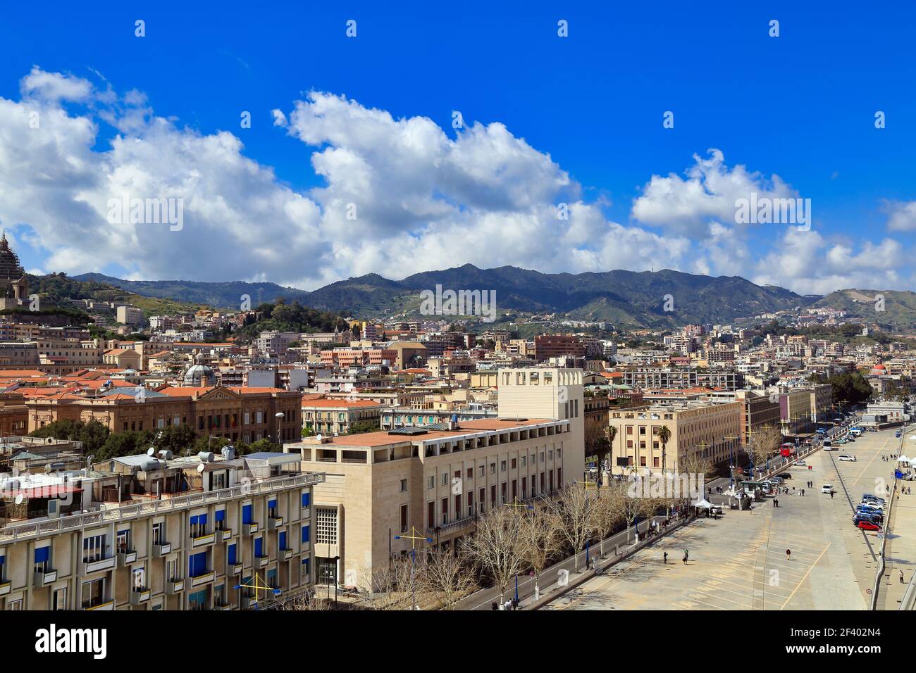 View across the rooftops from the port of Messina, Sicily, with the Peloritani mountains in the distance Stock Photo