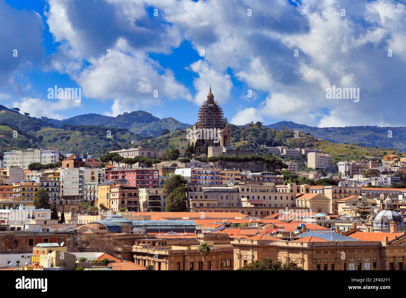 View across the rooftops from the port of Messina, Sicily, with the Peloritani mountains in the distance Stock Photo