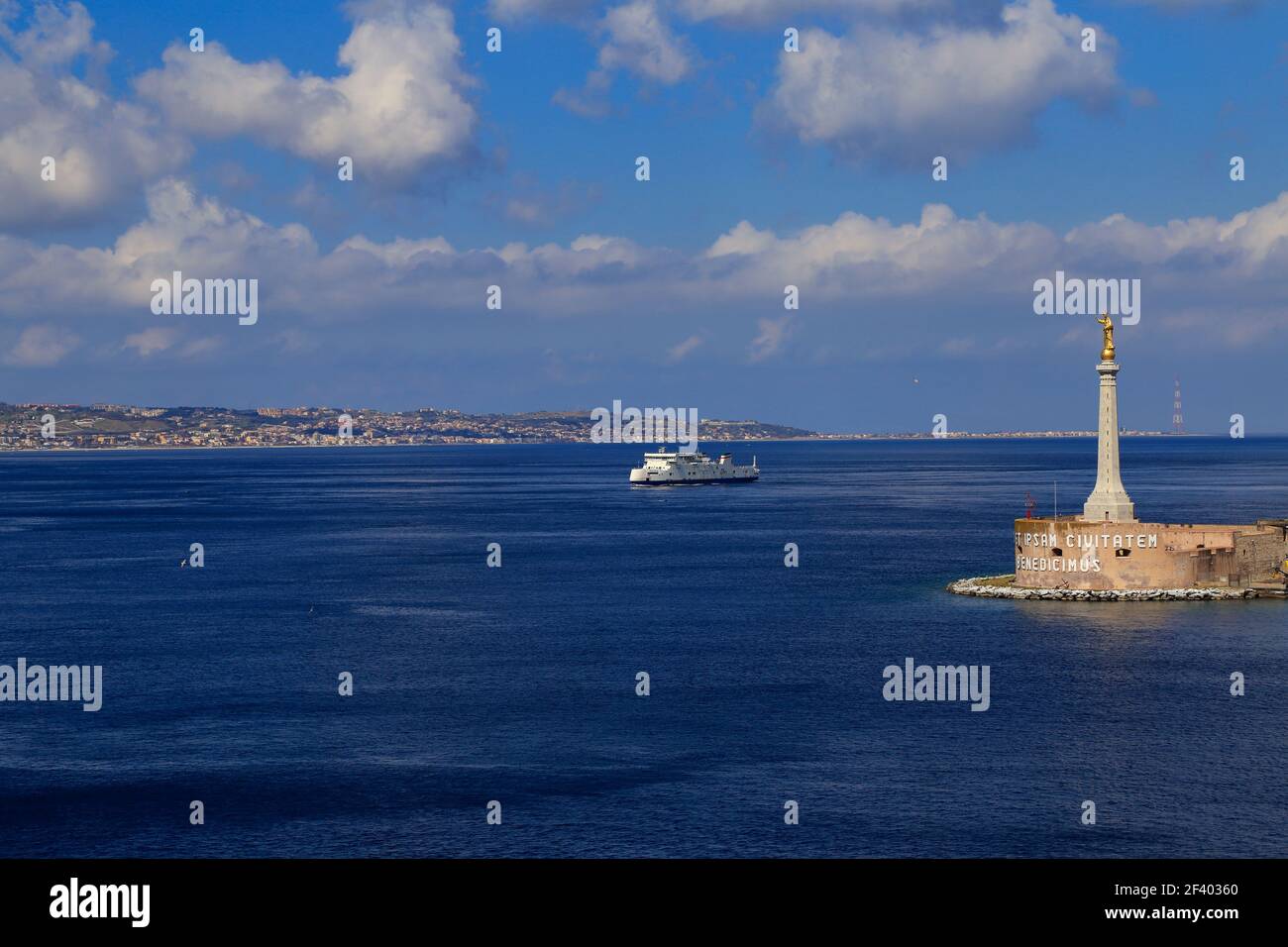 The entrance to Messina harbour, with the gold statue of Madonna della Lettera, Sicily, Italy Stock Photo