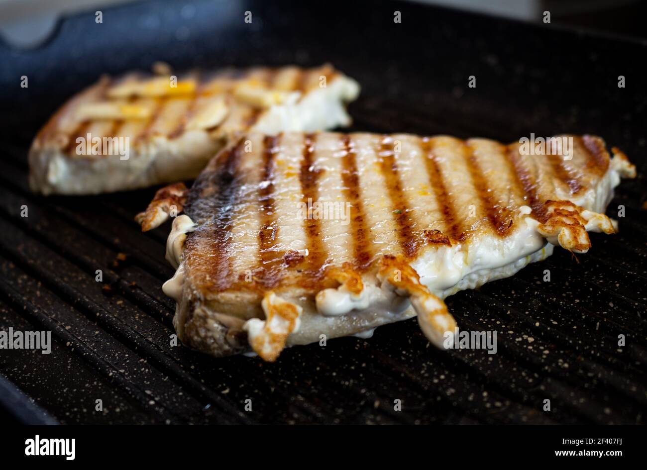 Pork steaks cooking on the grill. Food for humans. Pork animal in steak