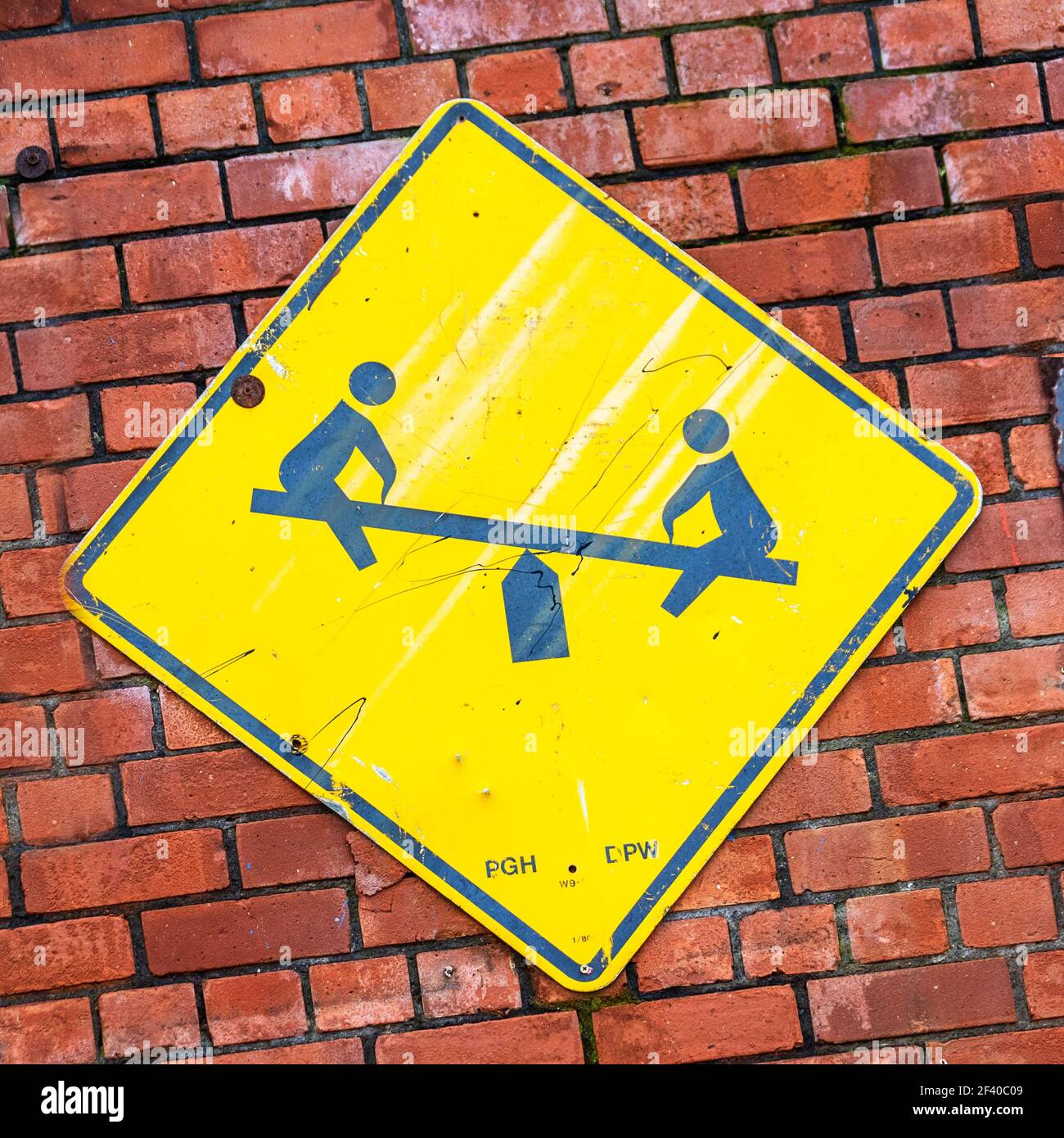 Seesaw teeter totter metal sign for a children's park or playground, UK