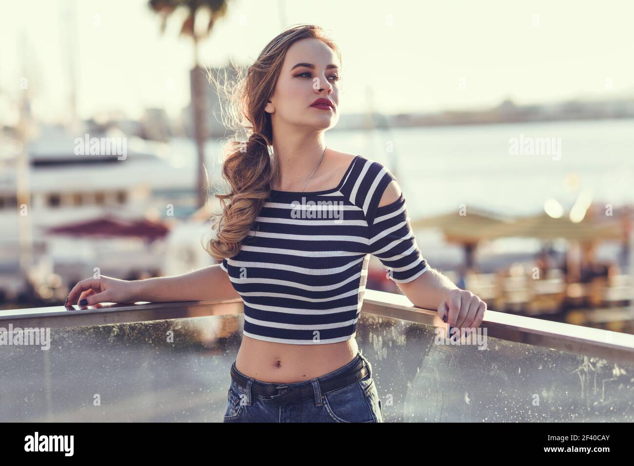 Girl wearing blue jeans and white shirt hi-res stock photography and images  - Alamy