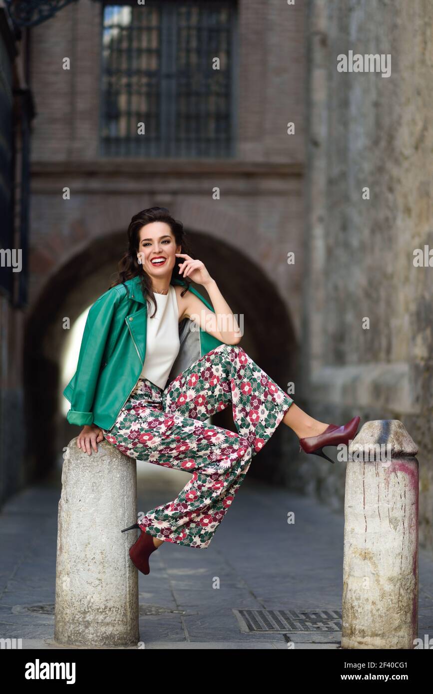 Woman wearing red pants hi-res stock photography and images - Alamy