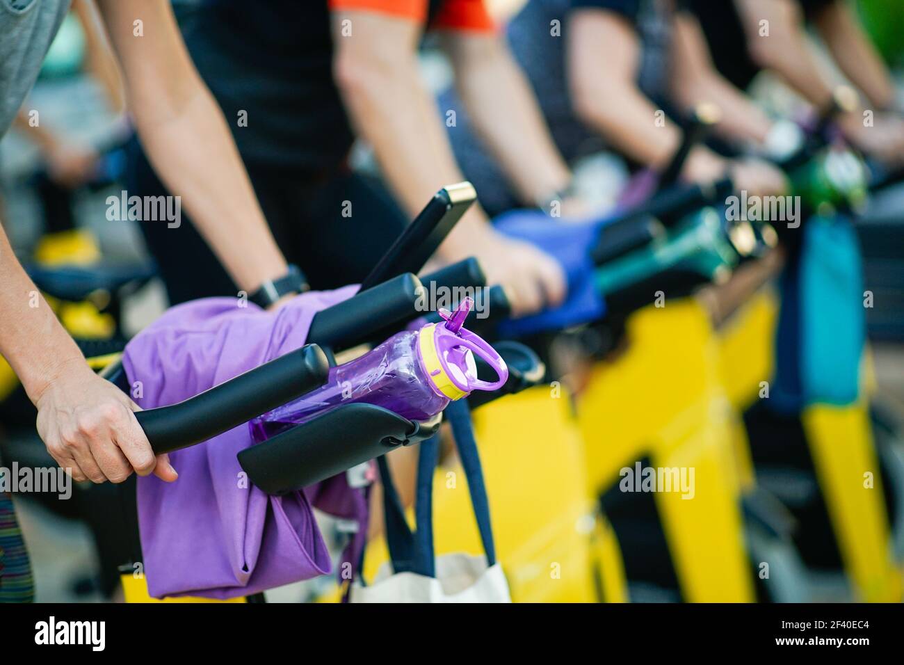 People training at a gym doing cyclo indoor. Sports and fitness concept. Stock Photo