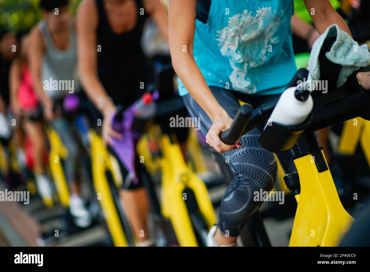 People training at a gym doing cyclo indoor. Sports and fitness concept. Stock Photo
