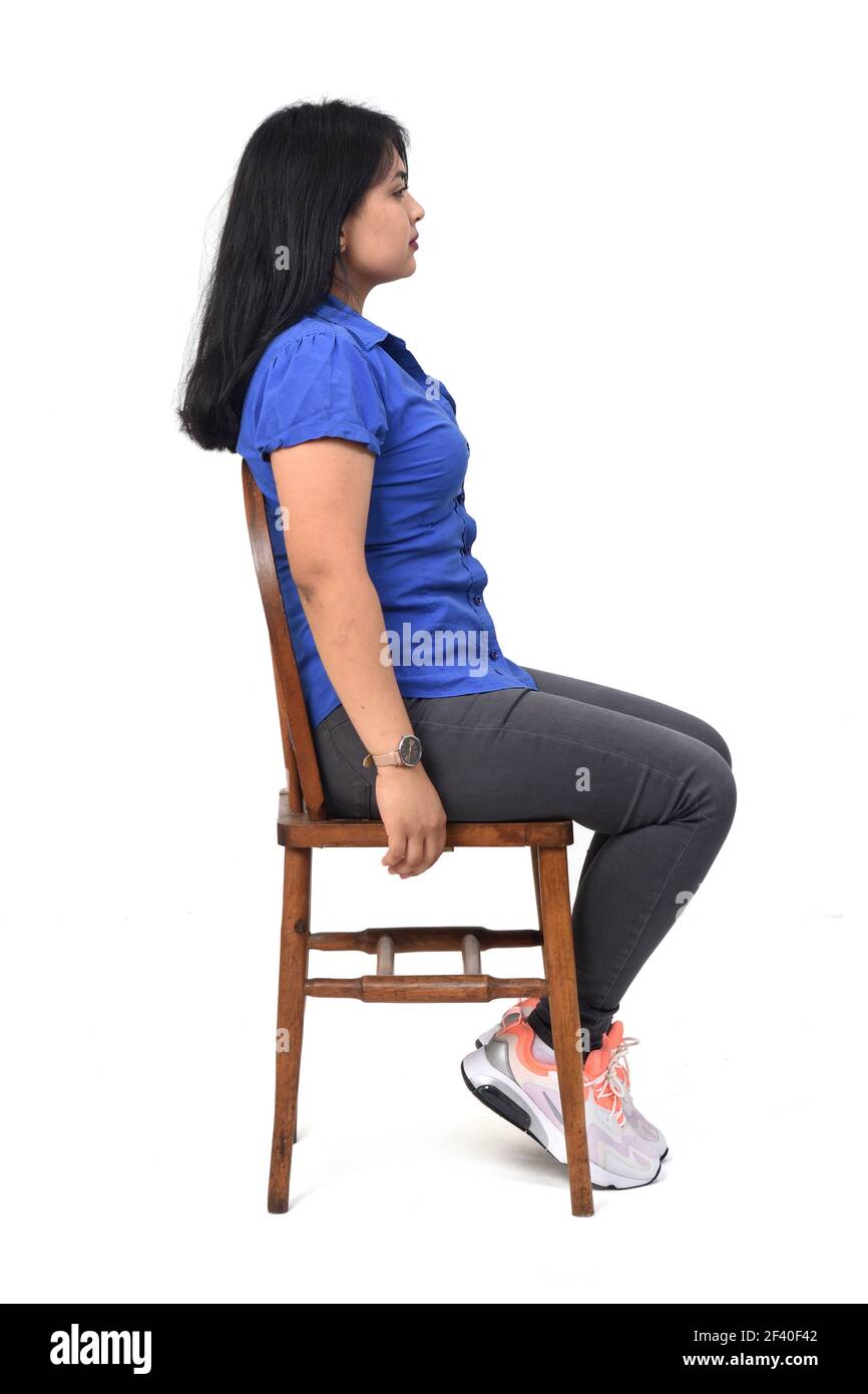 full portrait of a latin woman dressed in jeans sneakers and shirt