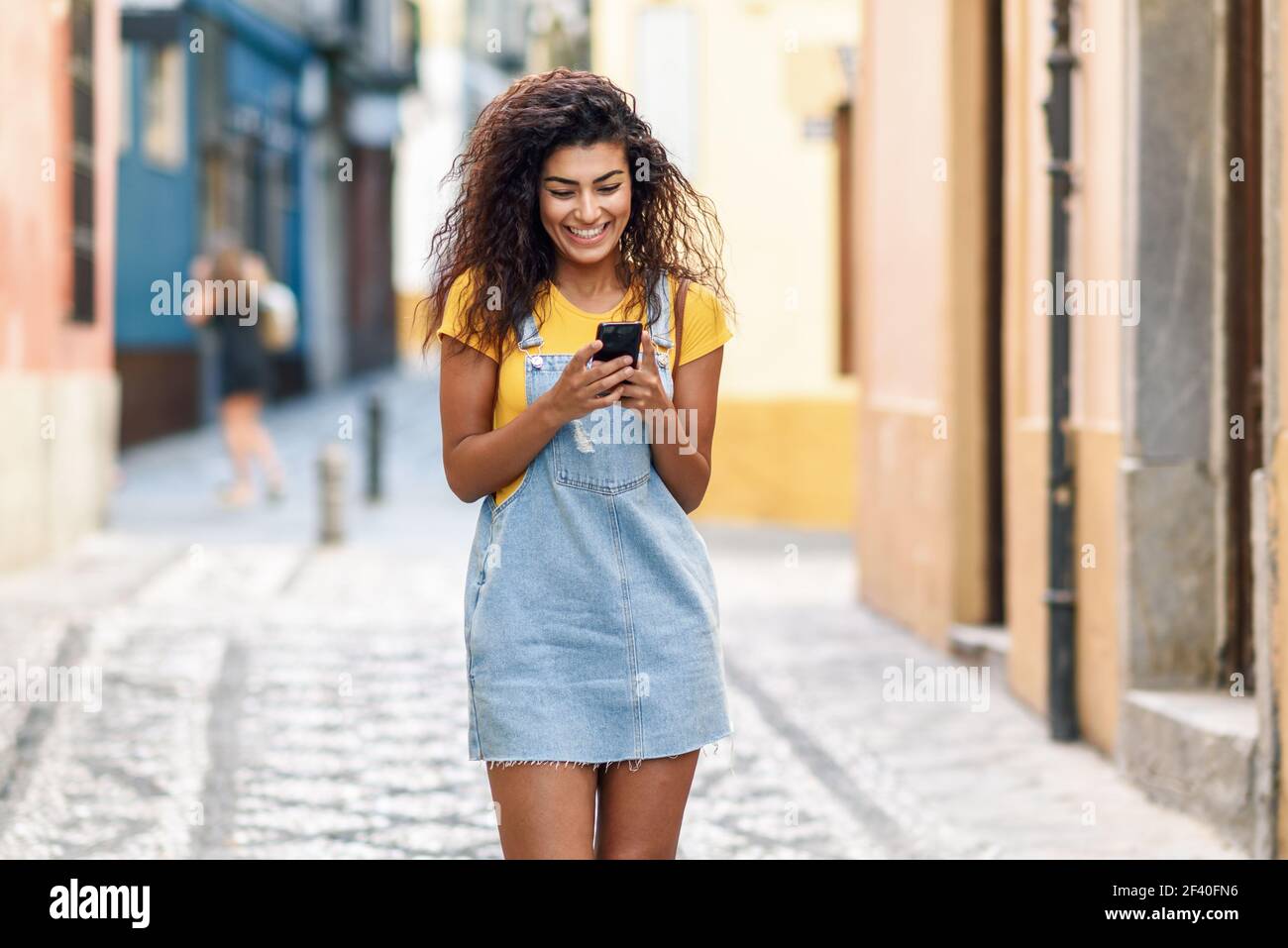 African woman walking hi-res stock photography and images - Alamy