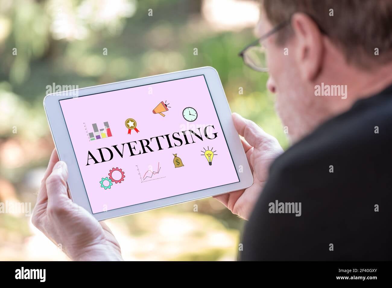 Tablet screen displaying an advertising concept Stock Photo - Alamy