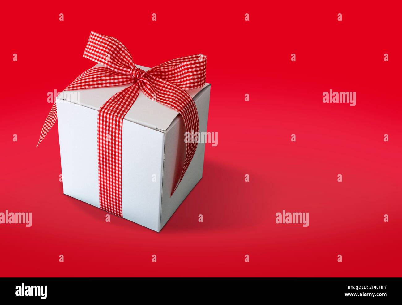 Gift box isolated on red background Stock Photo