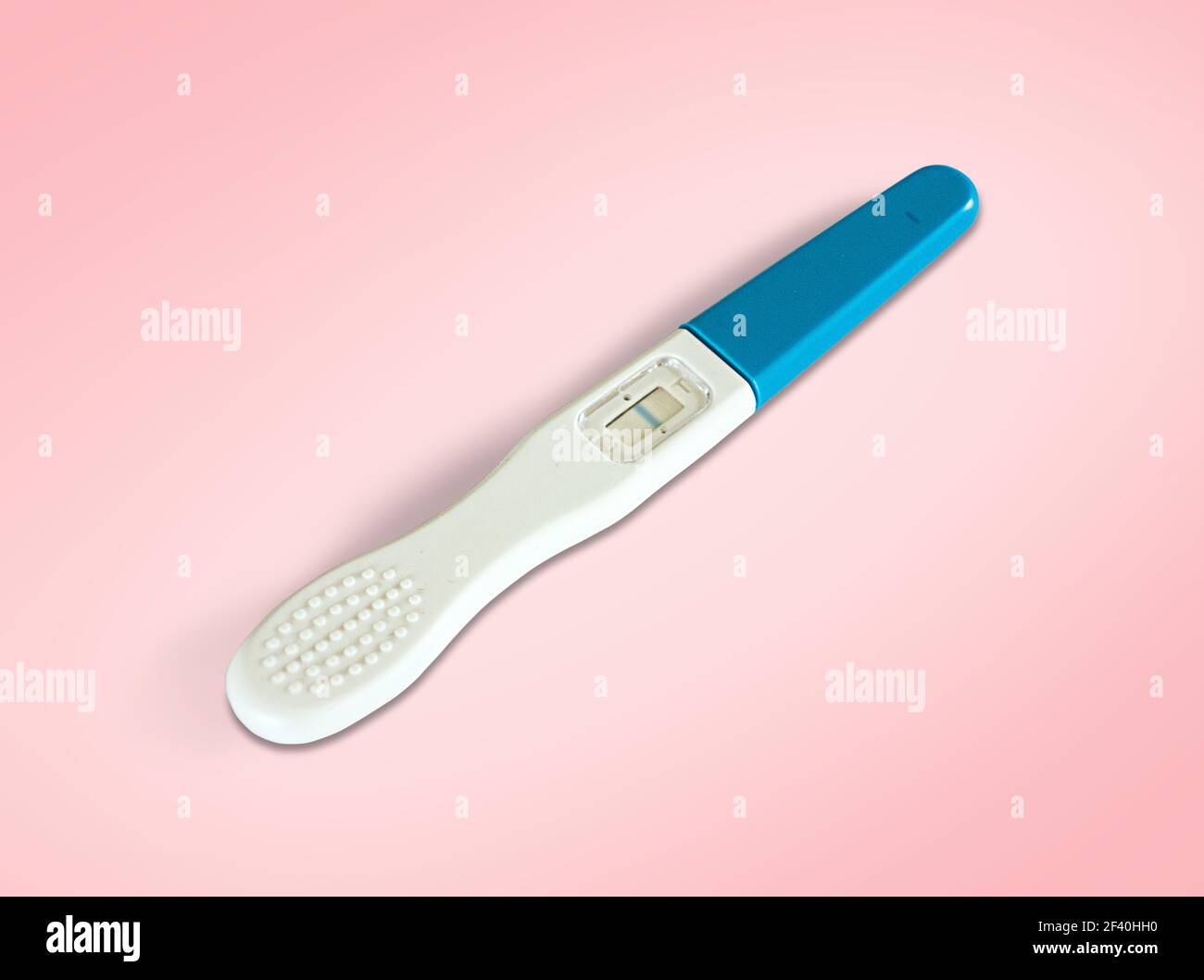 Close up pregnancy test isolated on pink Stock Photo