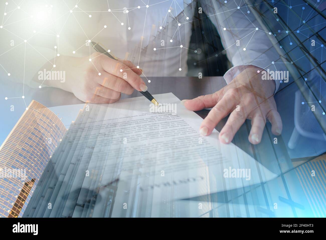 Woman signing a car purchase contract in car dealership; multiple exposure Stock Photo