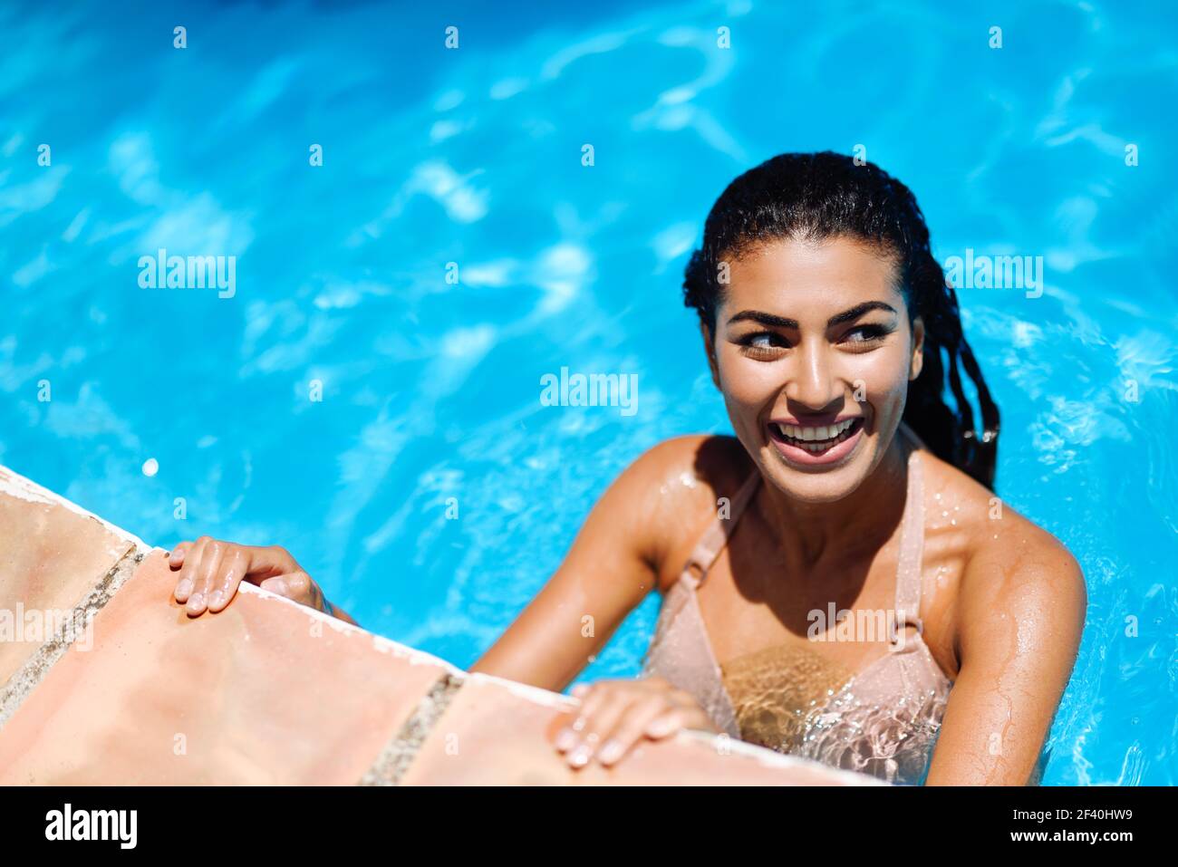 Happy Young Woman Relaxing In Swimming Pool Smiling Girl With Healthy Tanned Skin And Wet Hair