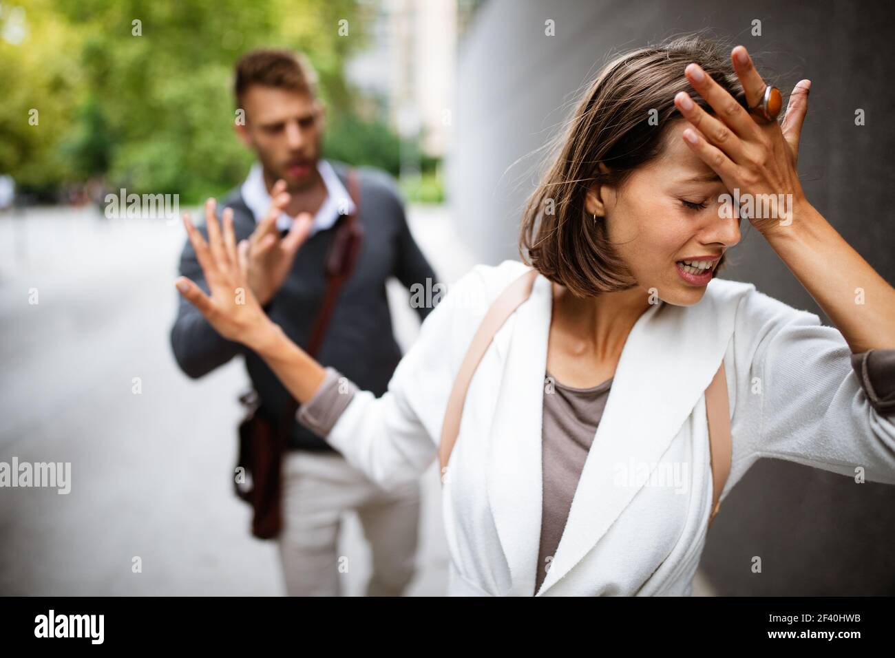 Breakup of couple with man and sad girlfriend outdoor. Divorce, couple, love, pain concept. Stock Photo