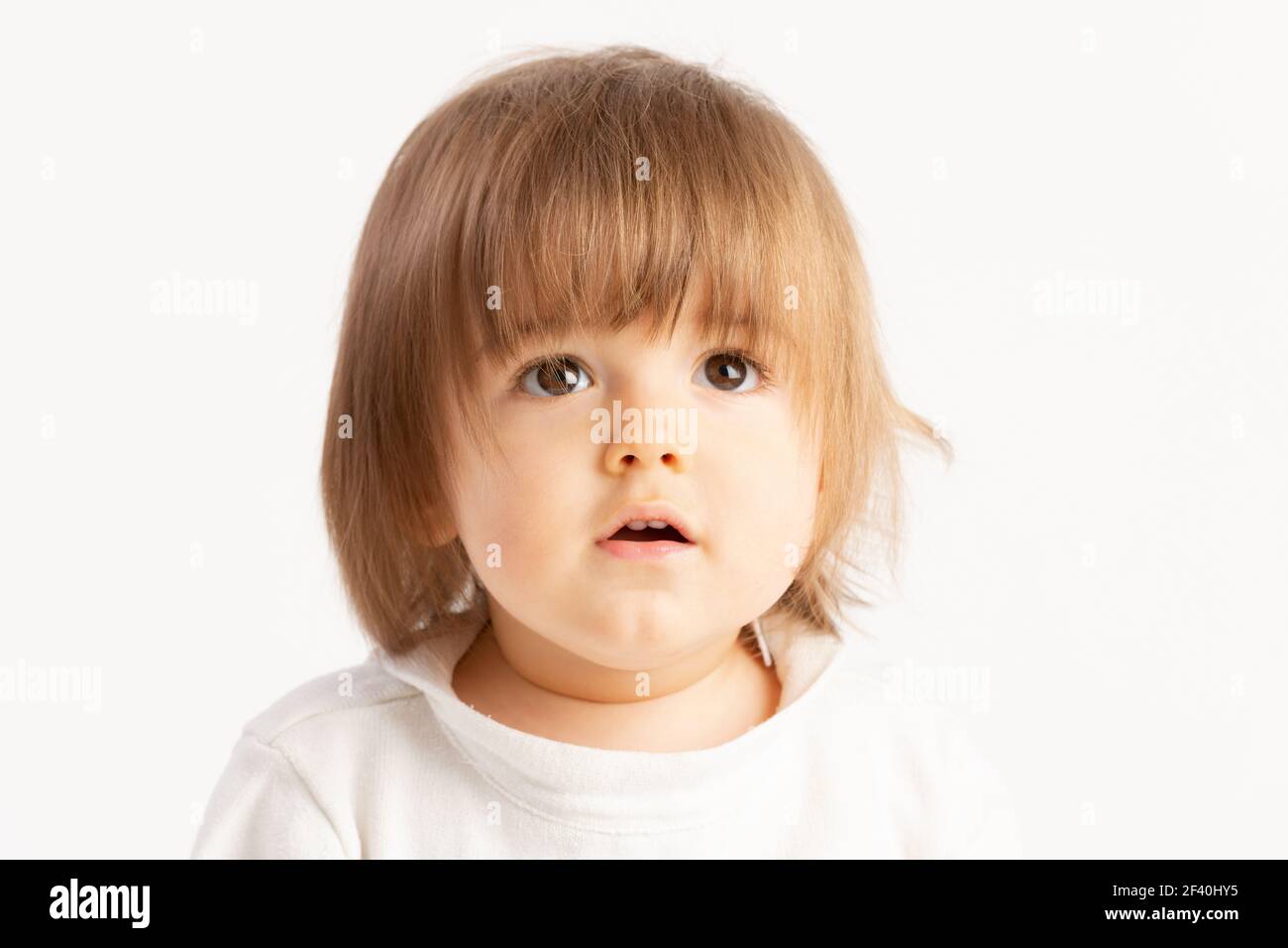 Close-up of a 1 year old baby boy with a Surprised face expression on white  background Stock Photo - Alamy