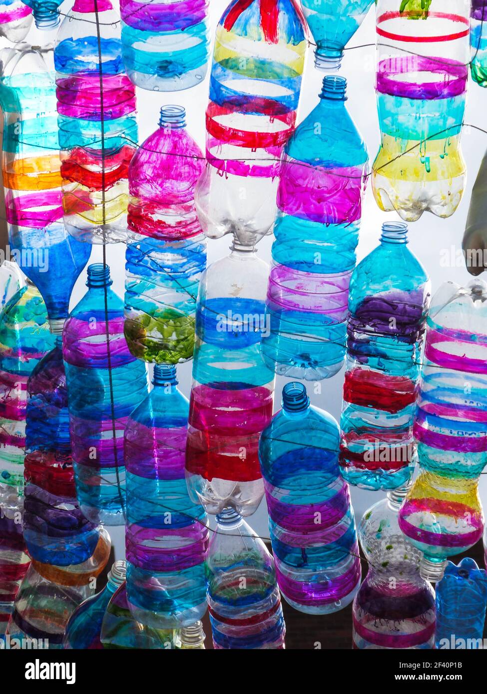 colorful plastic bottles hanging in a row in dublin Stock Photo Alamy
