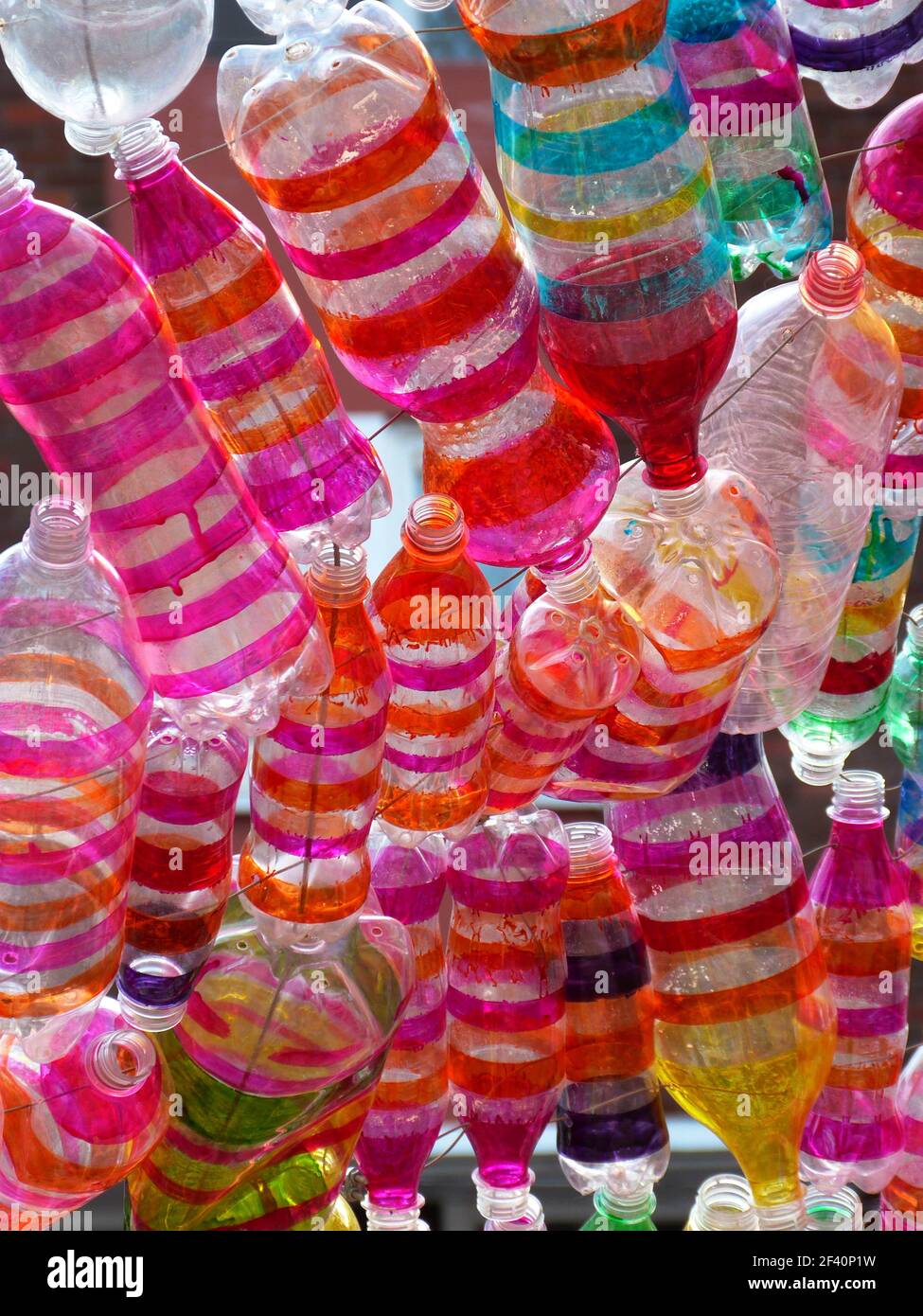 colorful plastic bottles hanging in a row in dublin Stock Photo Alamy
