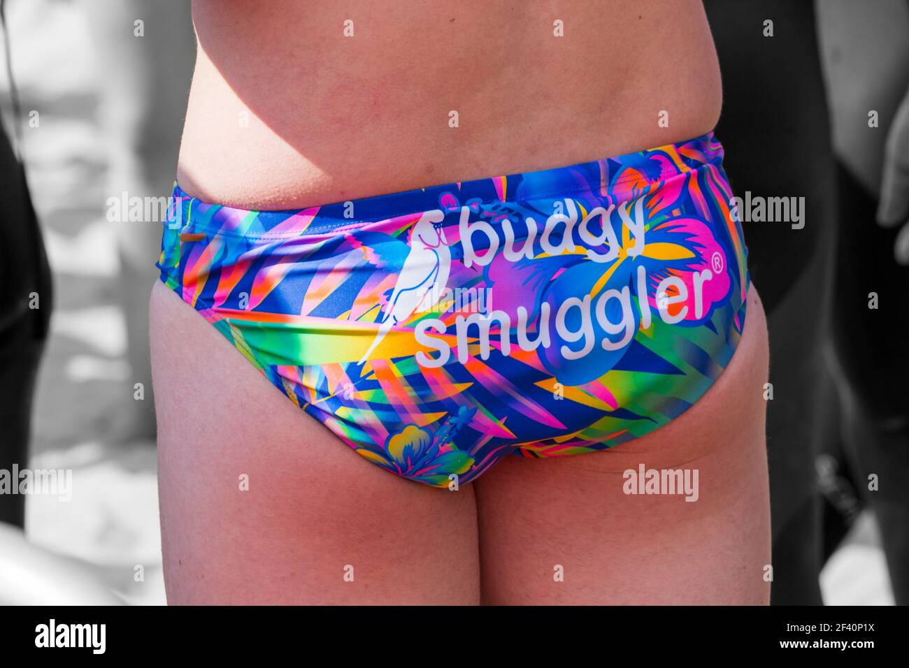 Man wearing budgy smuggler swimming trunks at Bournemouth, Dorset UK in August Stock Photo