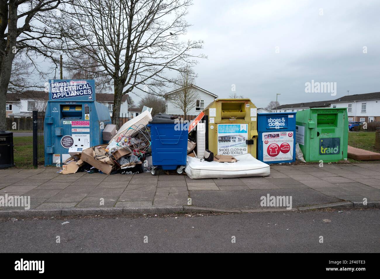 Waste disposal and overflowing rubbish bins Stock Photo