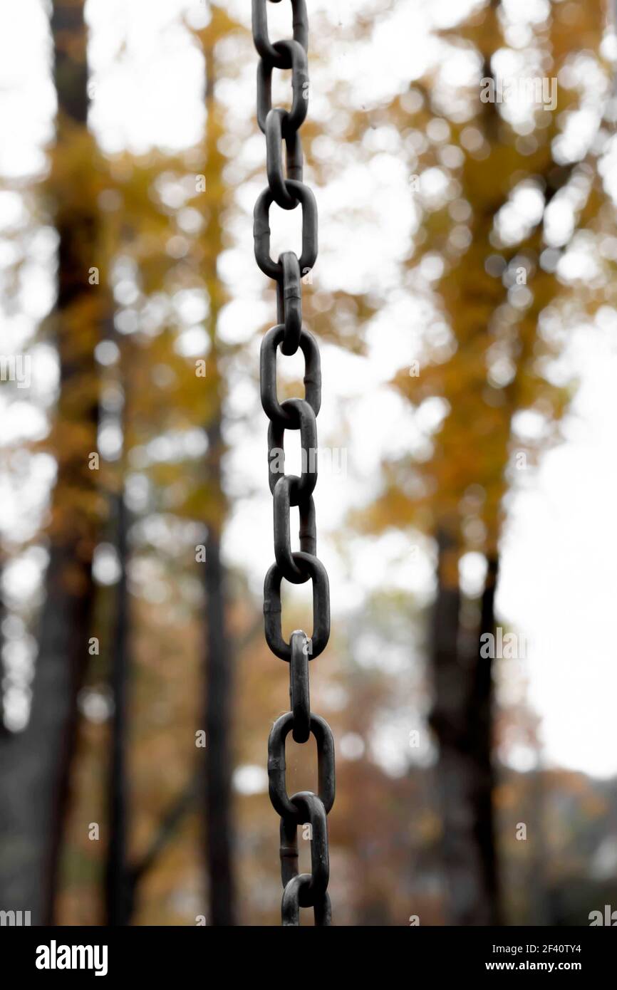 A metal chain of link hangs from the sky Stock Photo