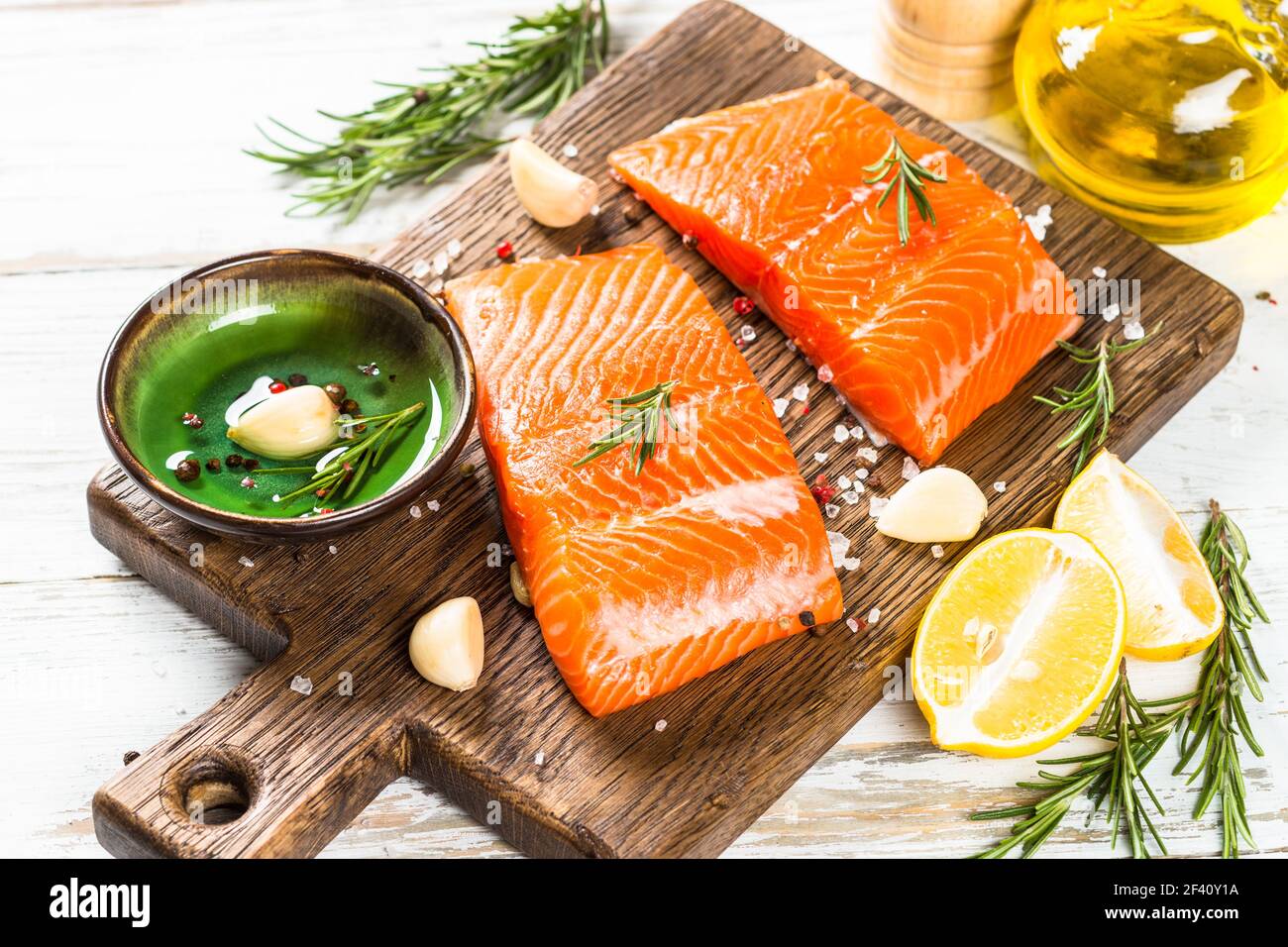 Salmon fish with ingredients at white table. Stock Photo