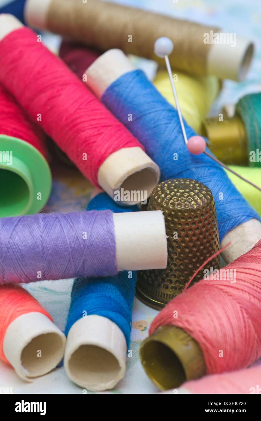 spools, pins and sewing thimble Stock Photo
