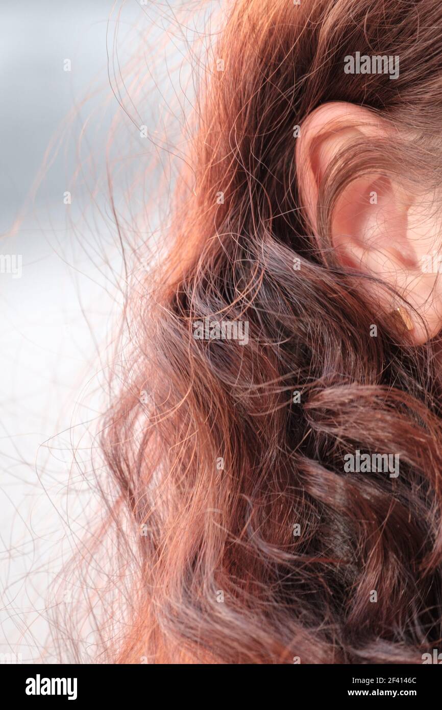 Closeup picture of redhaired girl ear with copyspace. Closeup picture of redhaired girl ear Stock Photo