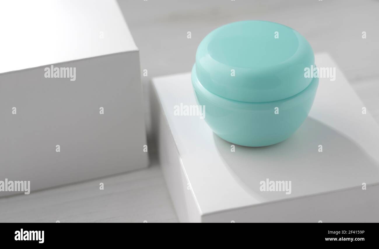 Blue moisturizer cream container on white box Stock Photo Alamy