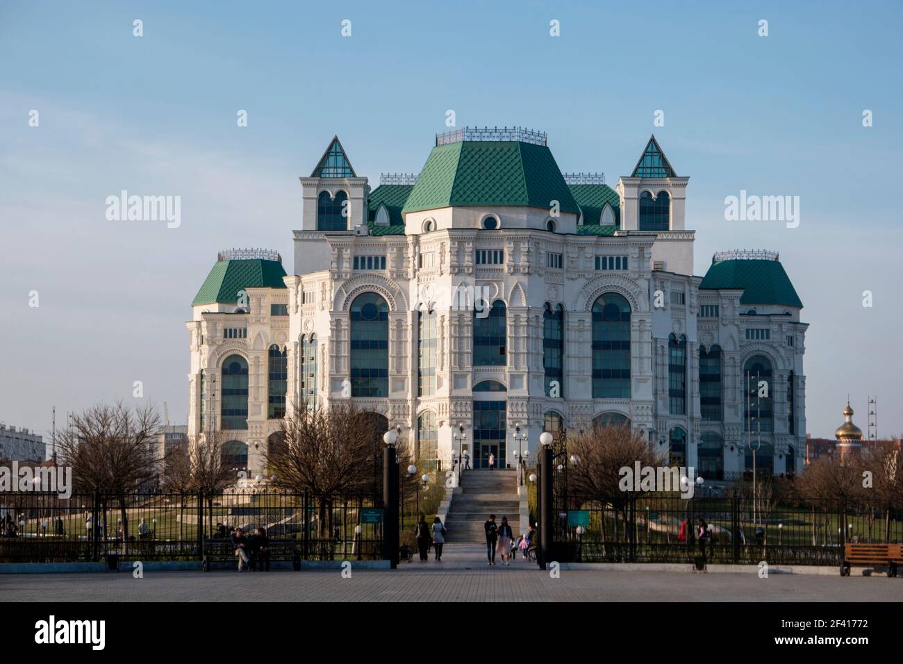 Astrakhan, Russia 12 of April 2018: Front View Of New Astrakhan Opera Theater In Sunny Spring Day With People Walking.. Astrakhan, Russia 12 of April 2018: New Astrakhan Opera Theater In Sunny Spring Day With People Walking. Stock Photo