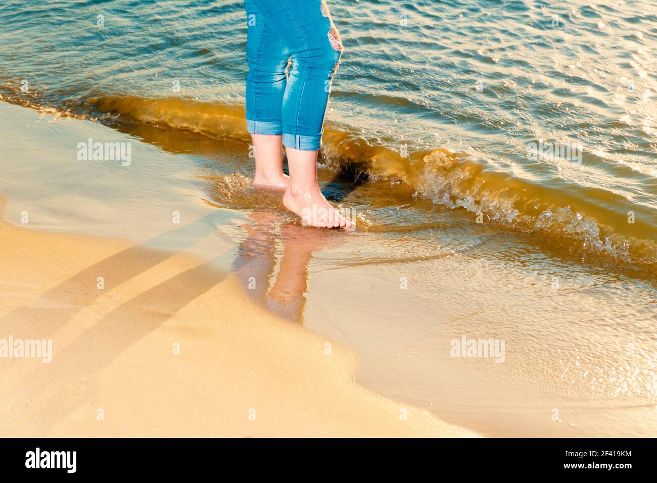 Woman barefoot walking sea hi-res stock photography and images - Alamy