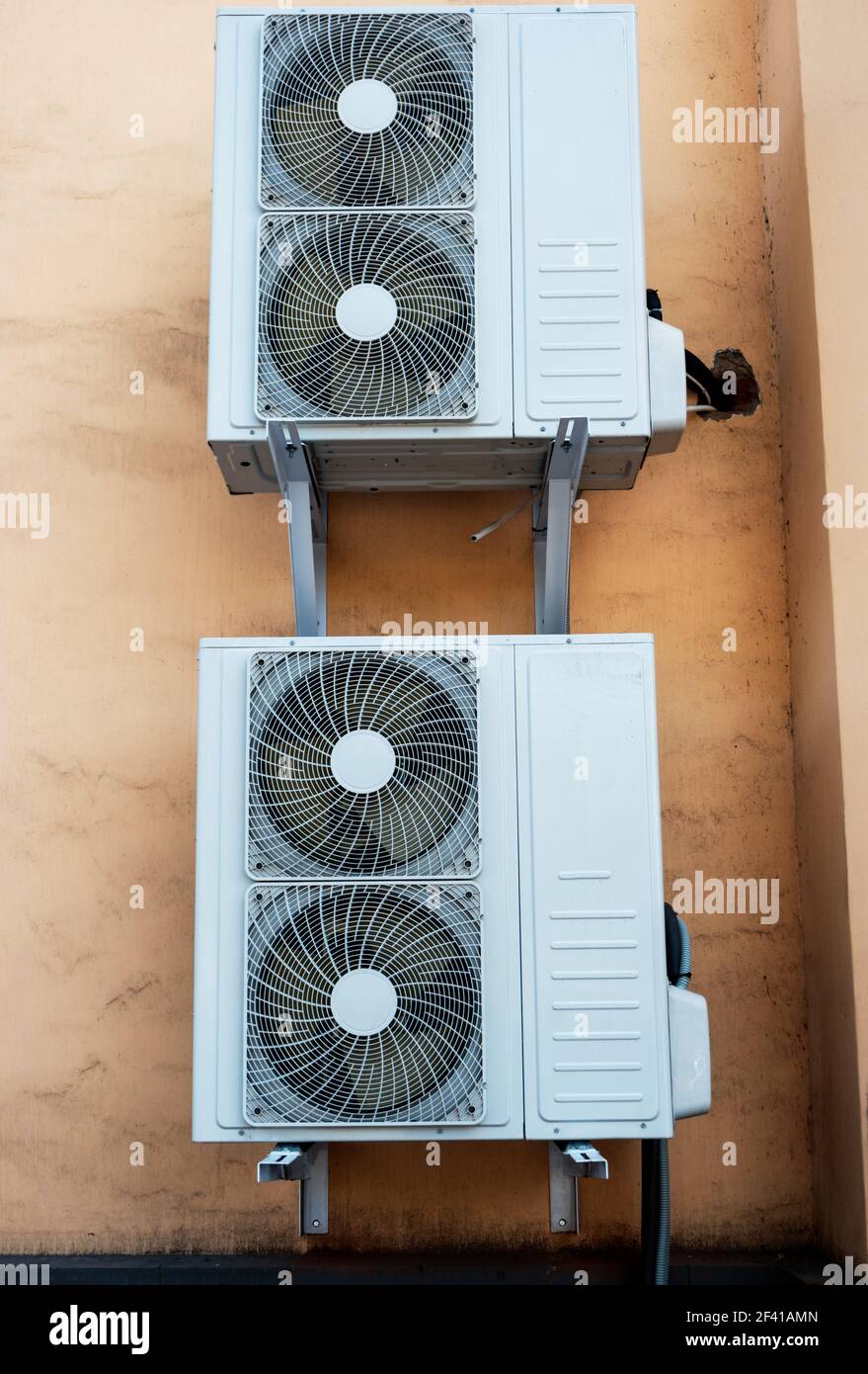 Two industrial air conditioner mounted on the wall. Two industrial air conditioner on the wall Stock Photo