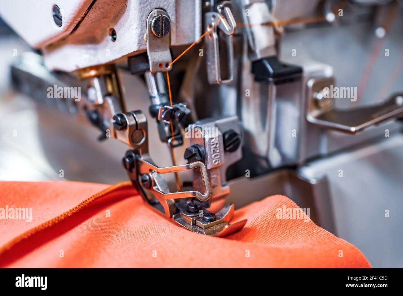 Professional sewing machine close-up. Modern textile industry. Stock Photo