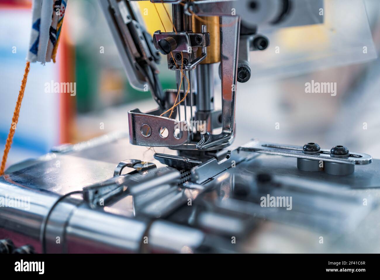 Professional sewing machine close-up. Modern textile industry. Stock Photo